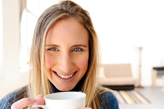 Happy woman with coffee