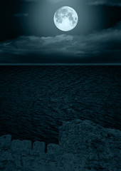 Fototapeta premium full moon in clouds reflected in water
