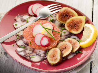 octopus carpaccio over grapefruit with figs and  radish