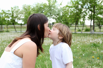 itlle girl with her mother outdoors