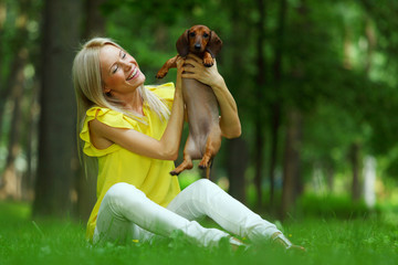 woman dachshund in her arms