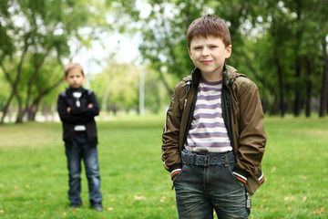 Boy with a friend in the green park