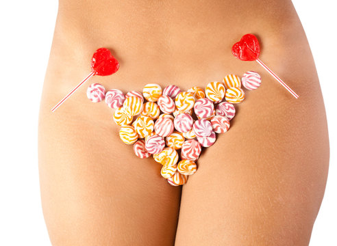 The girl in bikini from sweets, on a white background