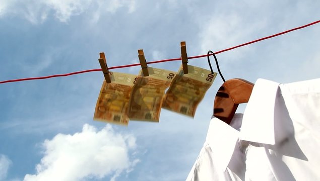 Money - with white shirt on a clothesline