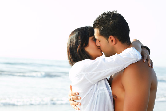 adorable  couple in love kissing and embracing each other