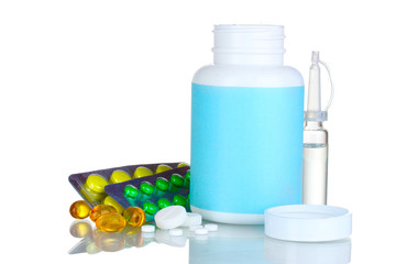 Medical bottles, ampoule and pills isolated on white