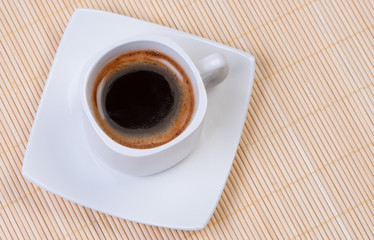 Coffee on bamboo mat top view.