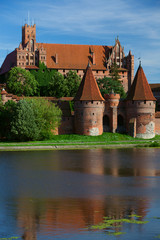 Malbork castle and reflection