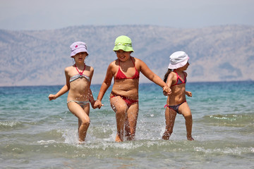 kids running on the beach