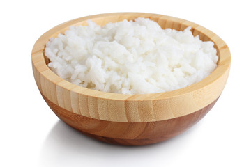Wooden bowl of cooked rice  isolated on white