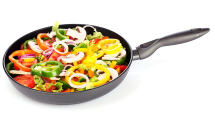 sliced ​​vegetables in a pan isolated on white