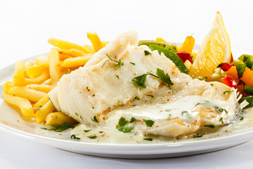 Fish dish - fish fillet, French fries and vegetables