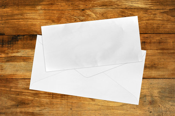 Vintage Envelope with blank Brown paper on wood