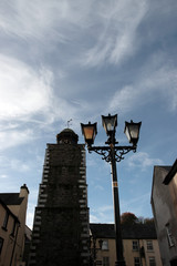 street lamp and clock at dusk
