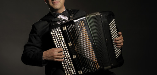 A man playing the accordion