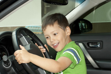 little boy sitting in the car