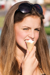 teen girl with ice cream in street