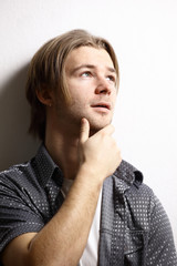 The beautiful young man on a white background