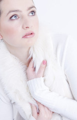 portrait of young woman wearing white sweater