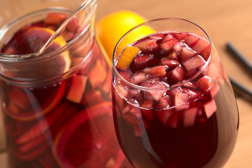 Red wine punch called sangria with orange, apple, mango