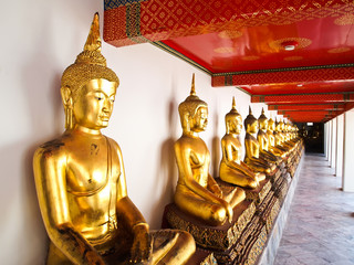 A row of seated Buddhas statue at Wat Pho