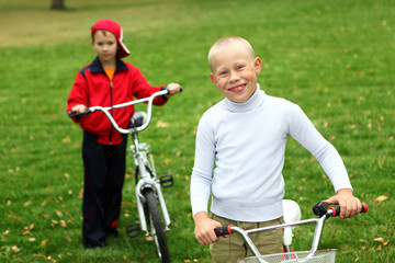 Boy on a bicycle in the green park