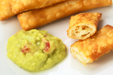 Appetizers called Tequenos with guacamole