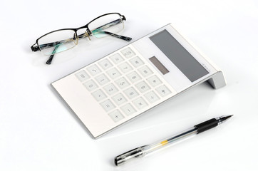 Calculator and pen with glasses