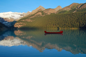 Red Voyageur Canoes on L. Louise at Dawn - Banff NP, Canada © Brian Lasenby