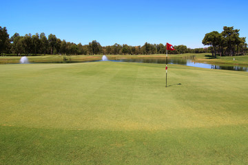 Golf course with water hazard.