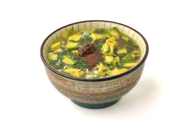 Tasty bowl of meat, avocado, onion soup