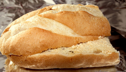 Fresh loaf with garlic butter  - on foil, ready to bake