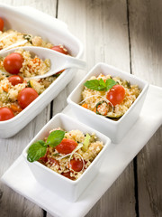 vegetable couscous with cerry tomatoes and mint leaf