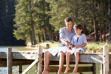 Fototapeta premium Father and son fishing together
