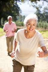 Senior couple on country run