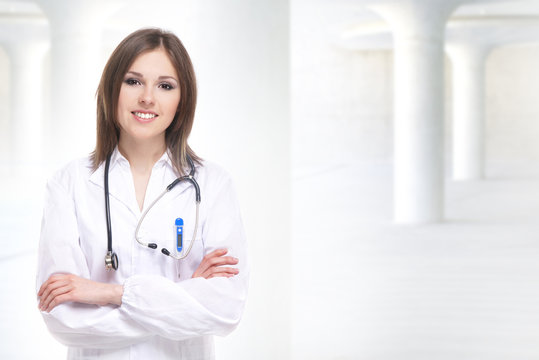 Young attractive doctor isolated over white background