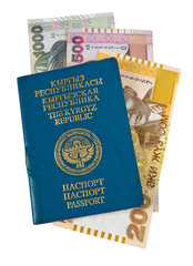 Naklejka premium Kyrgyz passport and money, isolated on white background