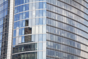 Obraz premium The glass facade office building full of offices.