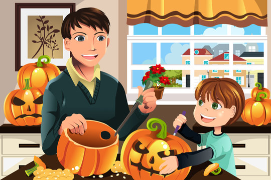 Father and son carving pumpkins