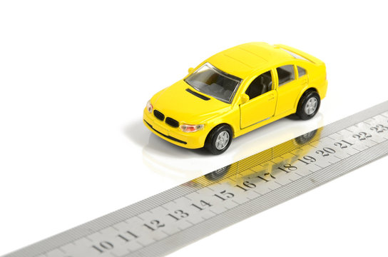 Steel ruler and toy car