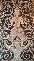 Old Thai art made from pearl on the door of Thai church,Thailand