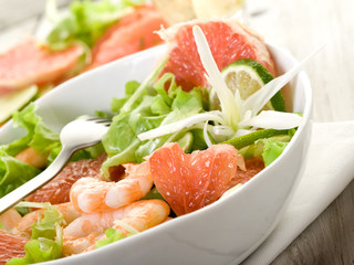 shrimp salad with slice grapefruit and lettuce