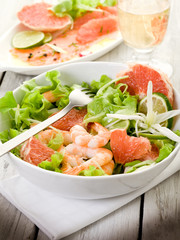 shrimp salad with slice grapefruit and lettuce