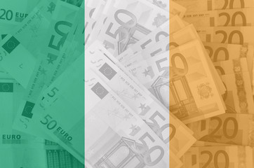 flag of Ireland with transparent euro banknotes in background
