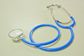 blue color stethoscope on the table