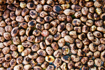 Background of a heap of roasted peanuts.