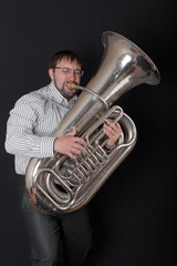 man playing a tuba