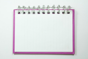 pink cover of open white note book