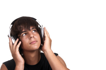 Fototapeta premium young boy listening to music with headphones