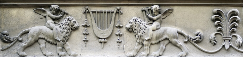 Bas-relief - boy sitting astride a lion © dmitrydesigner